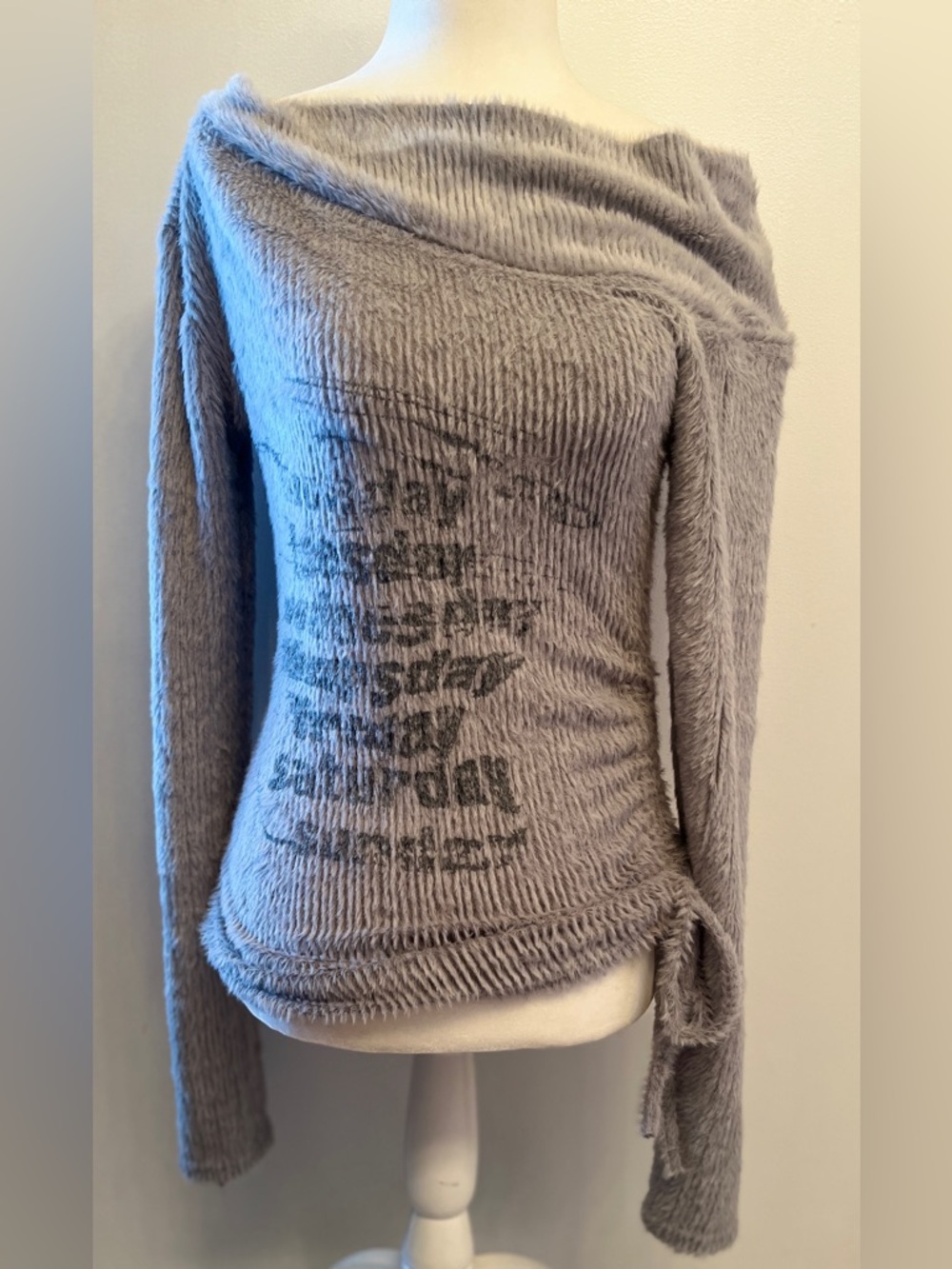 Off- the-shoulder Y2K-style long-sleeve knit top featuring ruched side details S